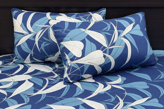 A custom bed sheet set with a floral print in blue tones