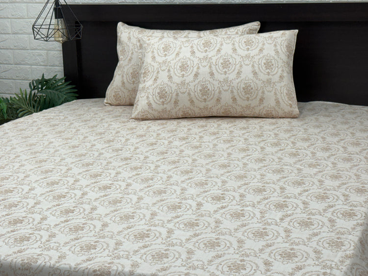 A custom bed sheet set with floral print in shades of beige displayed on a bed 3.