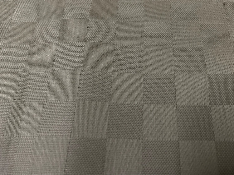 Close-up view of a beige checkered pattern bed sheet fabric 3.