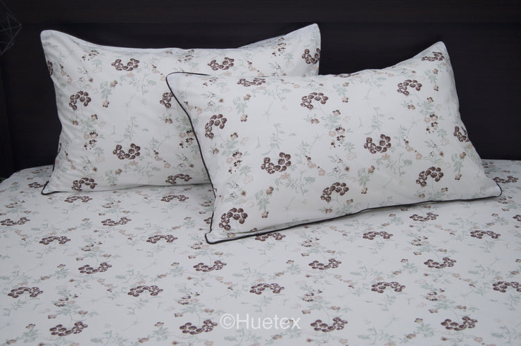Custom bed sheet set with floral print with brown, white, and green colors 1.