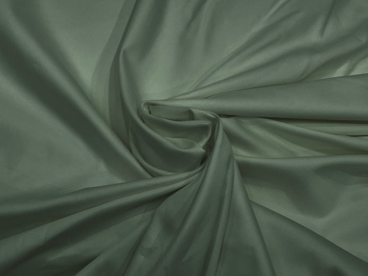 Elegant drape of soft, sage green fabric with a subtle sheen.