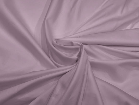 Lilac fabric with soft folds creates a swirling pattern.