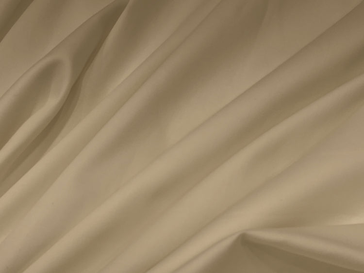 Smooth, beige satin fabric with soft folds and gentle draping.