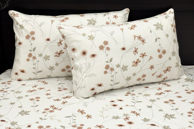 White cotton bedsheet with brown floral print and two pillows 1.