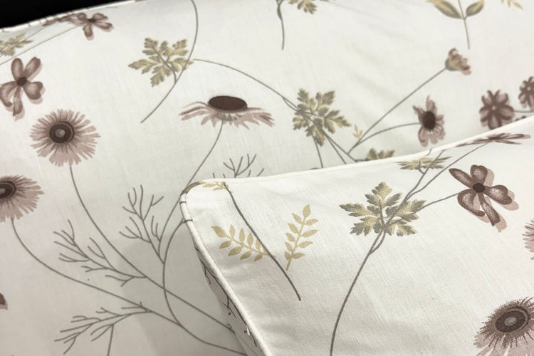 cotton bedsheet ,pillow with floral print displayed on the bed