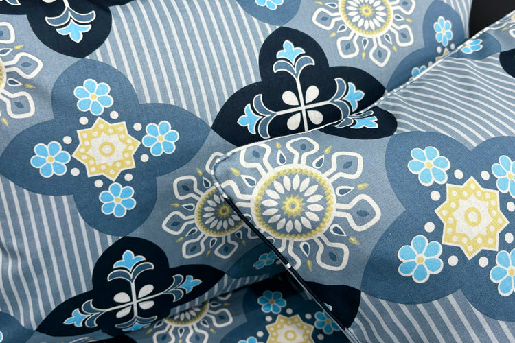 pillows with a floral print design in blue color