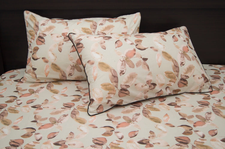 Custom bed sheet set with a leaves print in shades of brown.