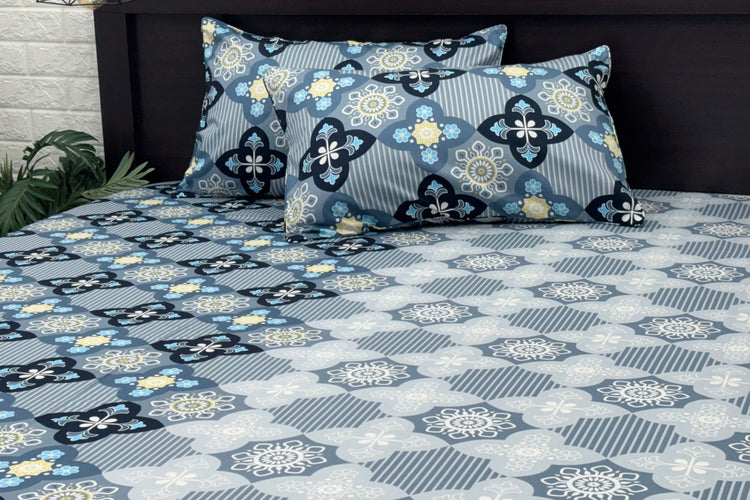 A bed sheet set with a floral print design in blue color 1