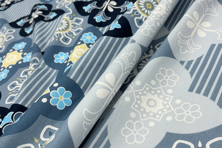 A bed sheet with a floral print design in blue color