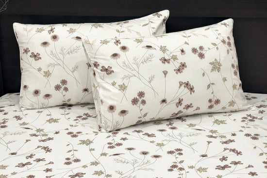 A custom bed sheet set, two cotton pillows with white and  featuring a floral print 1.