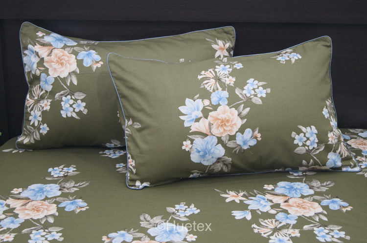 A custom bed sheet set with a floral geometric print in green 1.