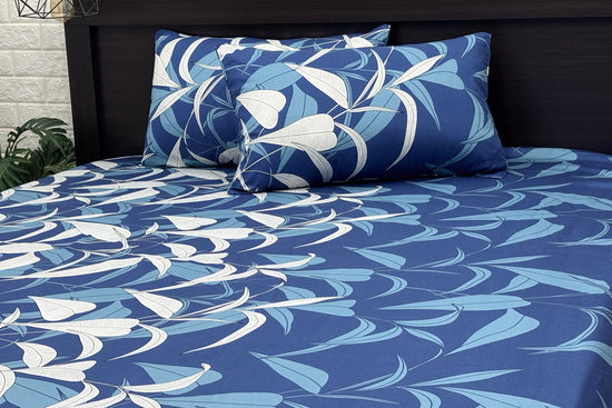A custom bed sheet set with a floral print in blue tones 1
