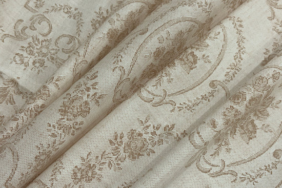 A custom bed sheet with floral print in shades of beige