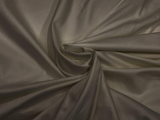 A khaki-colored, soft sateen weave bed sheet .