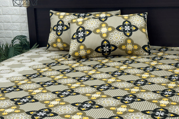 A set of bed sheets and pillows with a green floral print pattern 1.