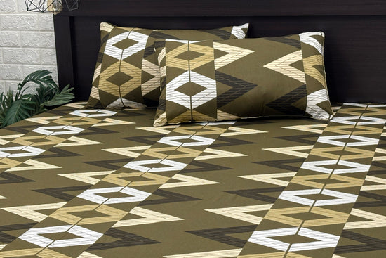 A set of green bed sheets and pillows with a geometric pattern 1.