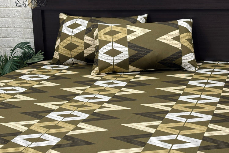 A set of green bed sheets and pillows with a geometric pattern 1.