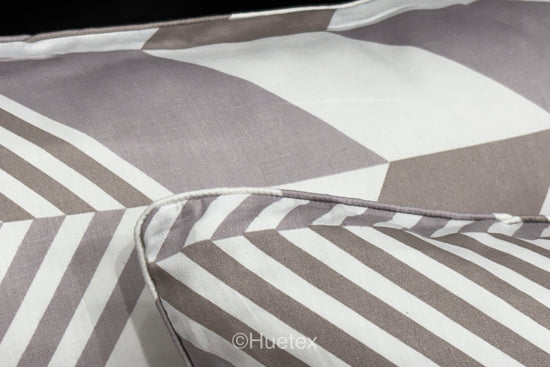 A set of pastel-colored bed sheets with pillow in a geometric print 2