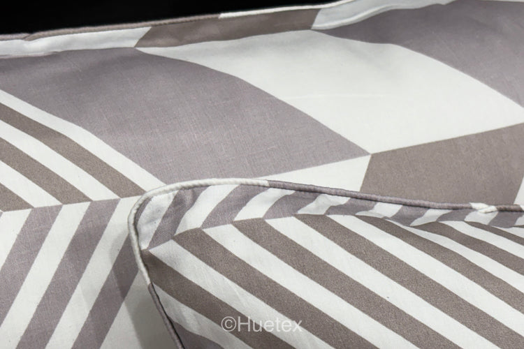 A set of pastel-colored bed sheets with pillow in a geometric print 2