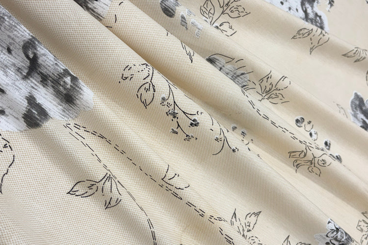 Beige  bedsheet with a delicate gray floral pattern.