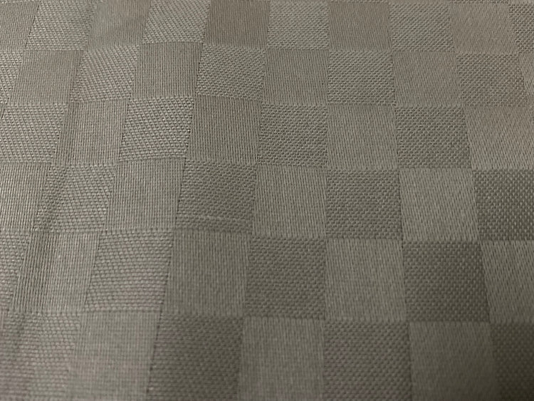 Close-up view of a beige checkered pattern bed sheet fabric 3.