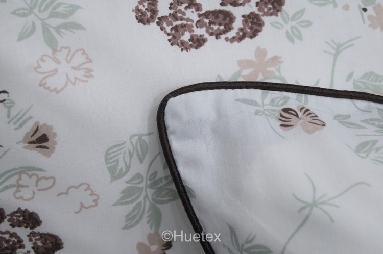 Custom bed sheet and pillow with floral print with brown, white, and green colors 