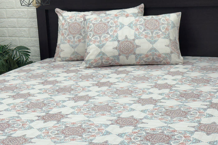 Custom bed sheet set  with geometric patterns in shades of white, blue, and pink.