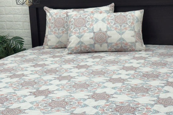 Custom bed sheet set  with geometric patterns in shades of white, blue, and pink.