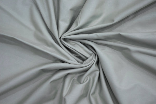 Gray fabric centrally twisted bedsheet.