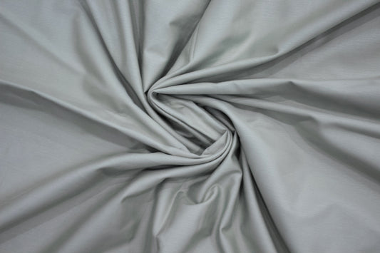 Gray fabric centrally twisted bedsheet.