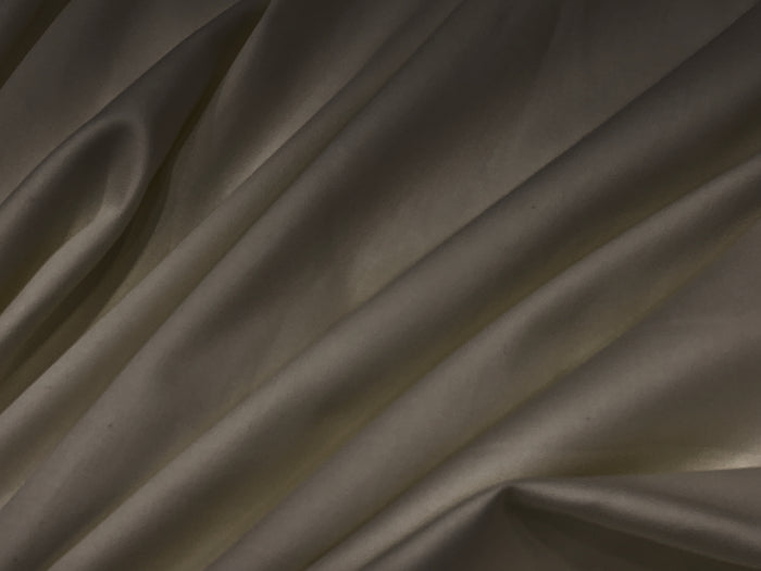 Smooth, dark brown fabricbedsheet with gentle folds