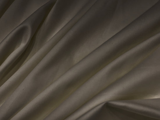 Smooth, dark brown fabricbedsheet with gentle folds