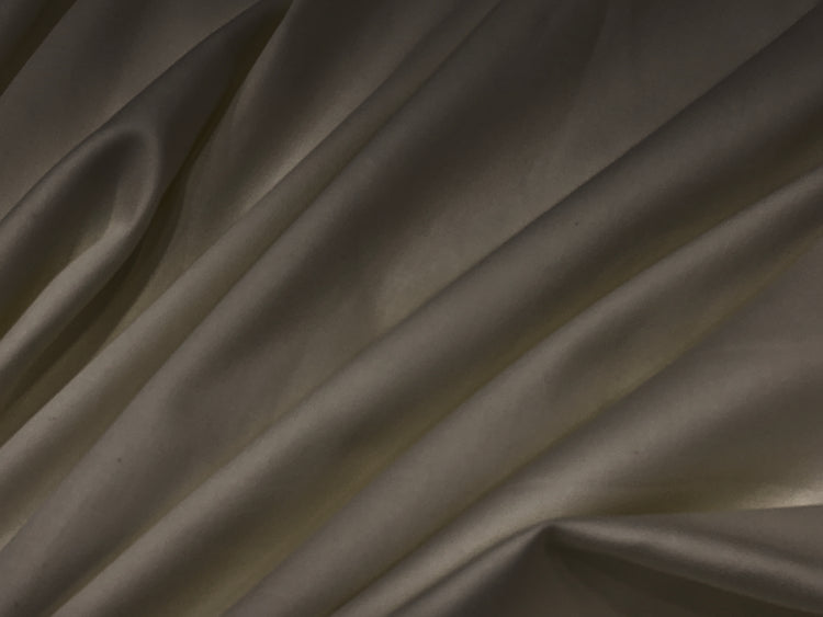 Smooth, dark brown fabricbedsheet with gentle folds