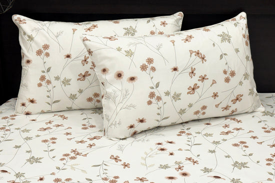 White cotton bedsheet with brown floral  print and two pillows 1.