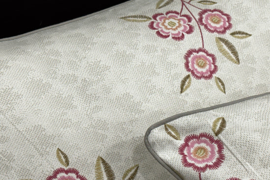 white bedsheet with brown and green leaf printed 