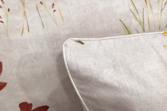 white with printed bedsheet and pillow neatly arranged on bed