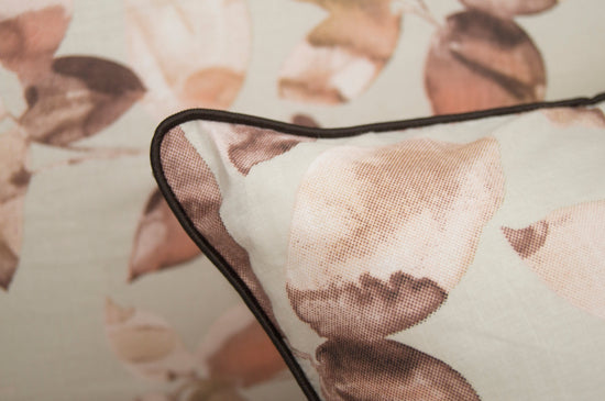 Custom bed sheet and pillow with a leaves print in shades of brown.